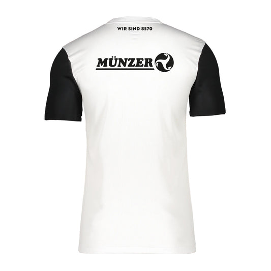ASK Voitsberg - Trikot weiß 25/26. Rückenansicht des weißen Trikot mit schwarzen kurzen Ärmeln mit der Aufschrift "Wir sind 8570" und dem Münzer Logo in schwarz.
